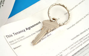 image of tenancy agreement papers and a house key