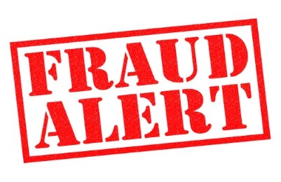 A stamp that reads: Fraud Alert