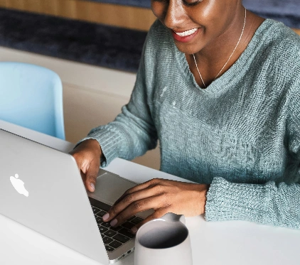 Person typing on a laptop at a desk