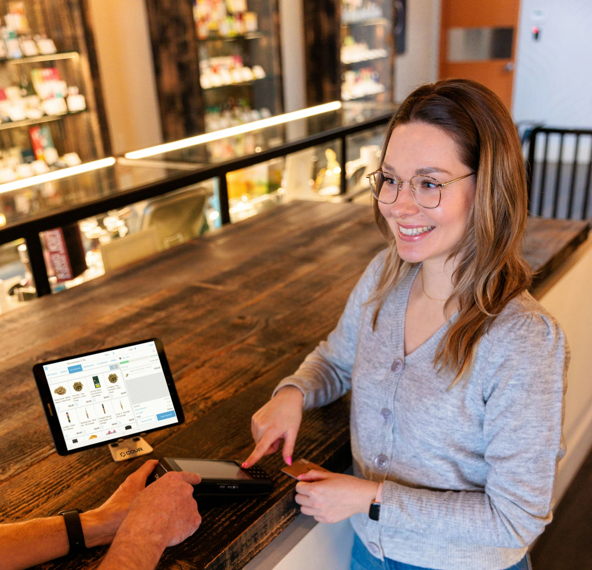 Women making a payment at a store checkout