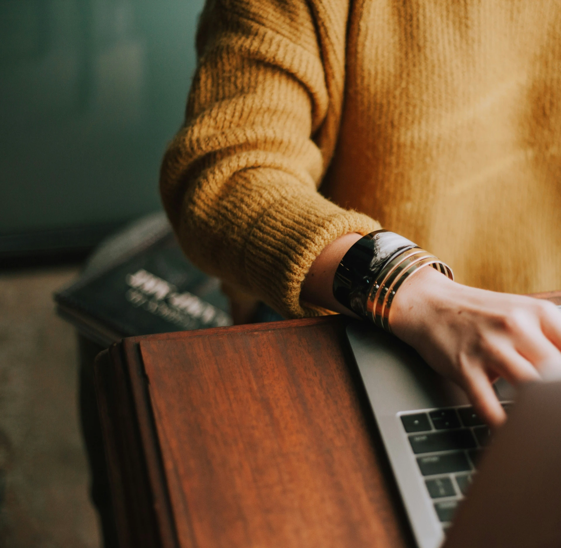 Person typing on a laptop keyboard
